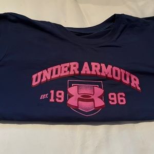 Blue under armour shirt with pink lettering on front and back. Size S